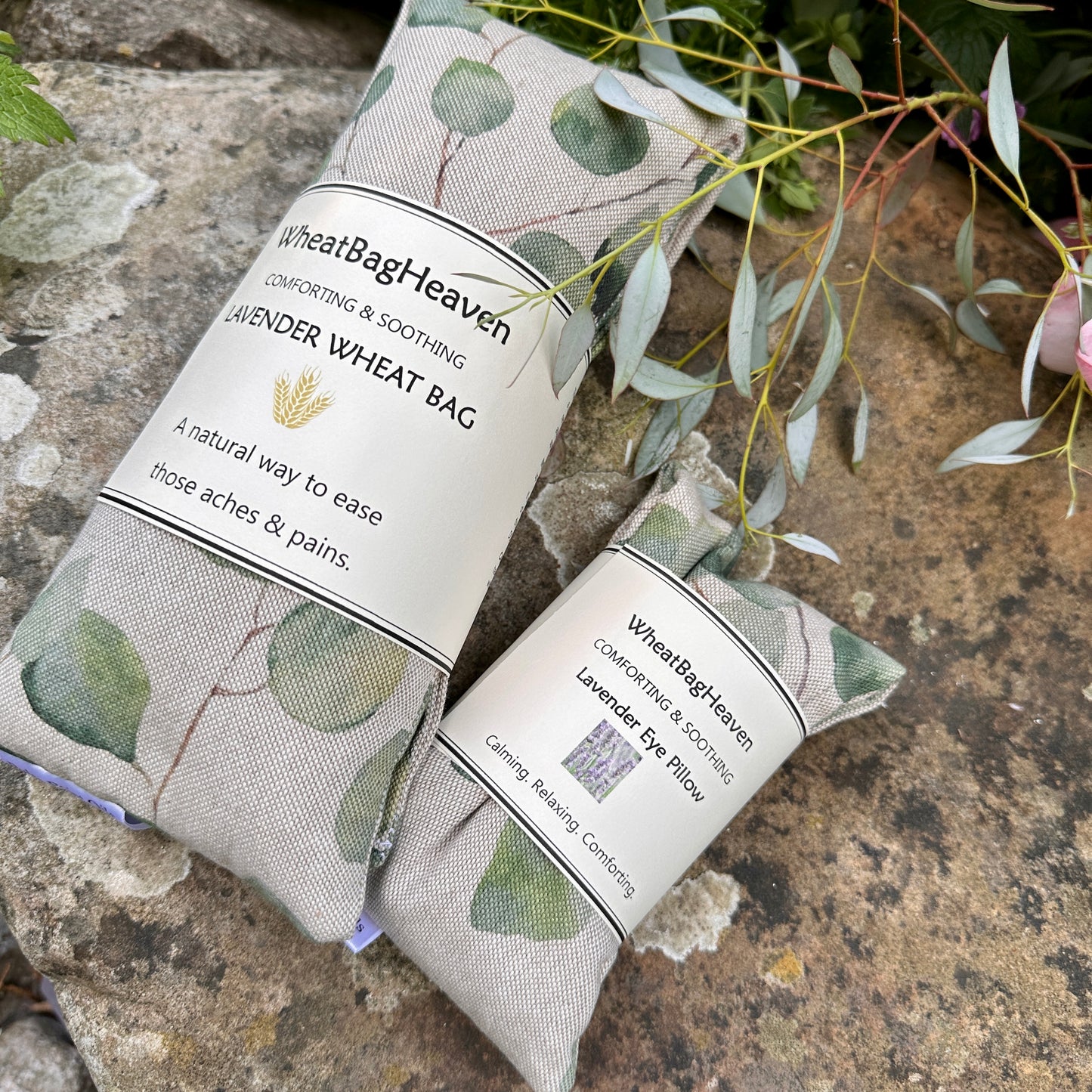 Wheat bag and eye pillow in a eucalyptus leaf print on a cotton linen fabric, handcrafted by WheatBagHeaven.com and available individually