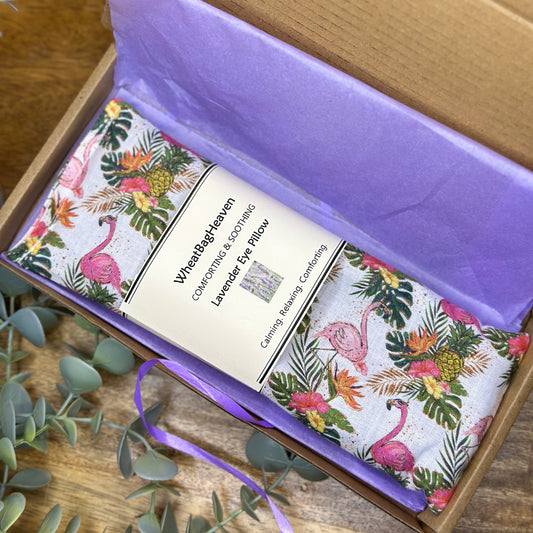pretty flamingo and floral print eye pillow, wrapped in tissue in a postal box
