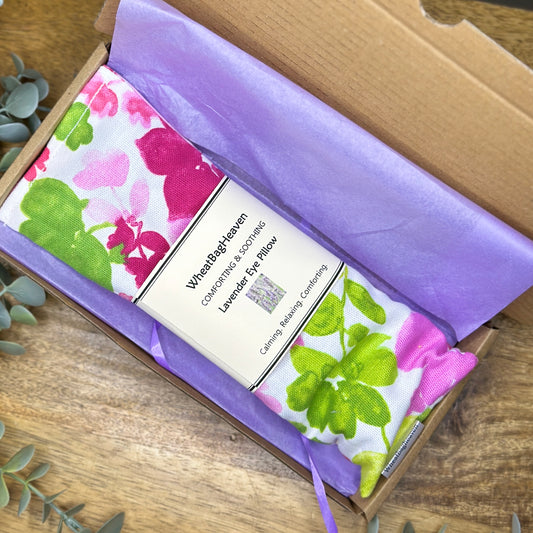 pink peonies cotton printed eye pillow with organic flax seed and English lavender, wrapped in lilac tissue in a letterbox postal box from WheatBagHeaven 