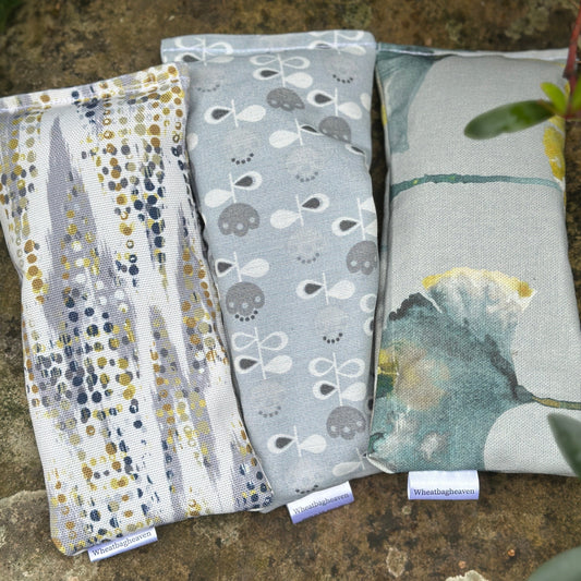 three eye pillows in shades of blue from wheat bag heaven.