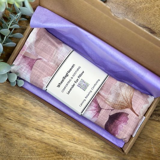 Pink eucalyptus floral print yoga meditation eye pillow. wrapped in lilac tissue in a letterbox sized postal box delivered with free UK shipping 