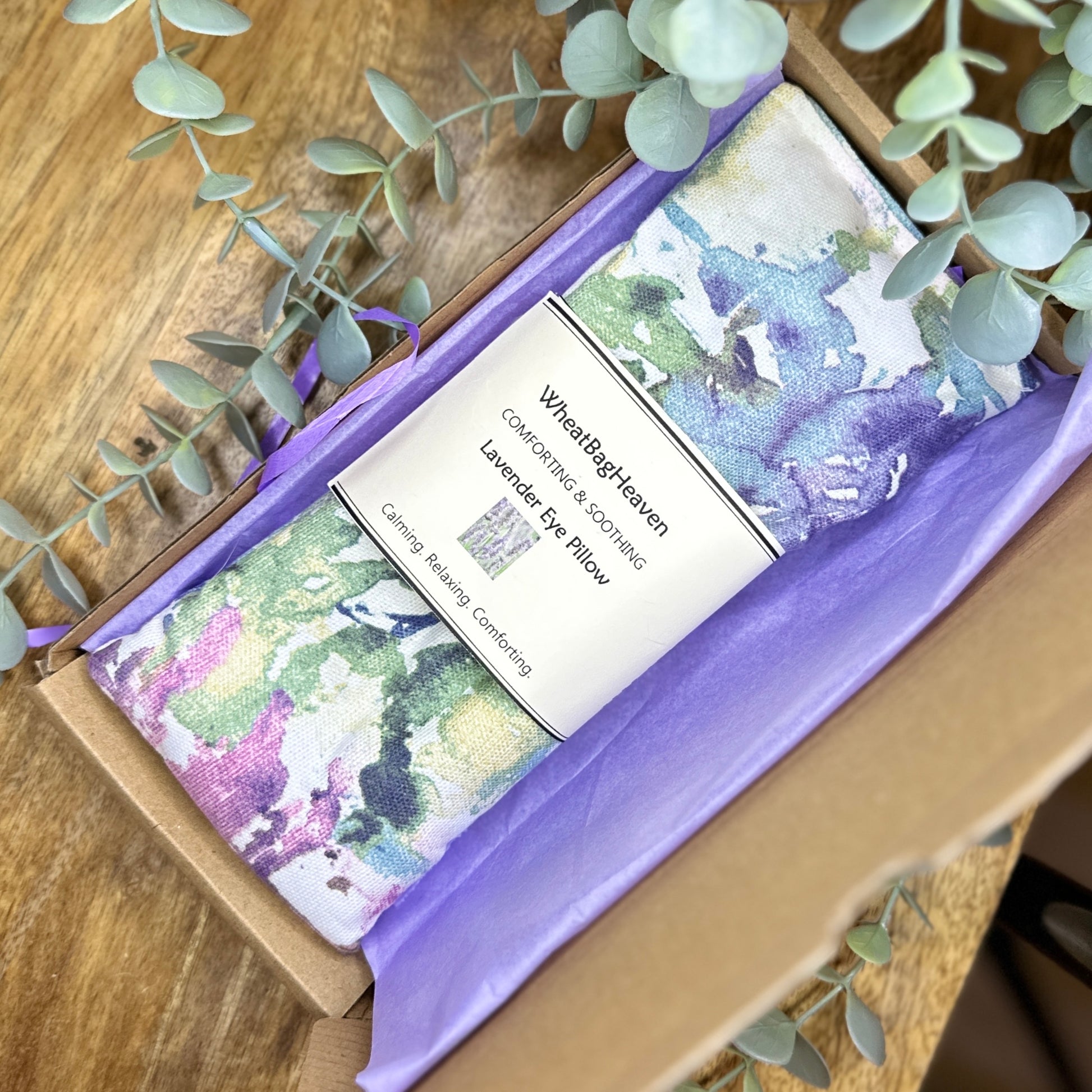 cotton eye pillow filled with organic flax seed and English lavender in pastel shades of blues, greens and pinks