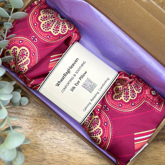 Hot pink art deco printed silk eye pillow with lilac tissue and ribbon. Letterbox gift with free UK shipping