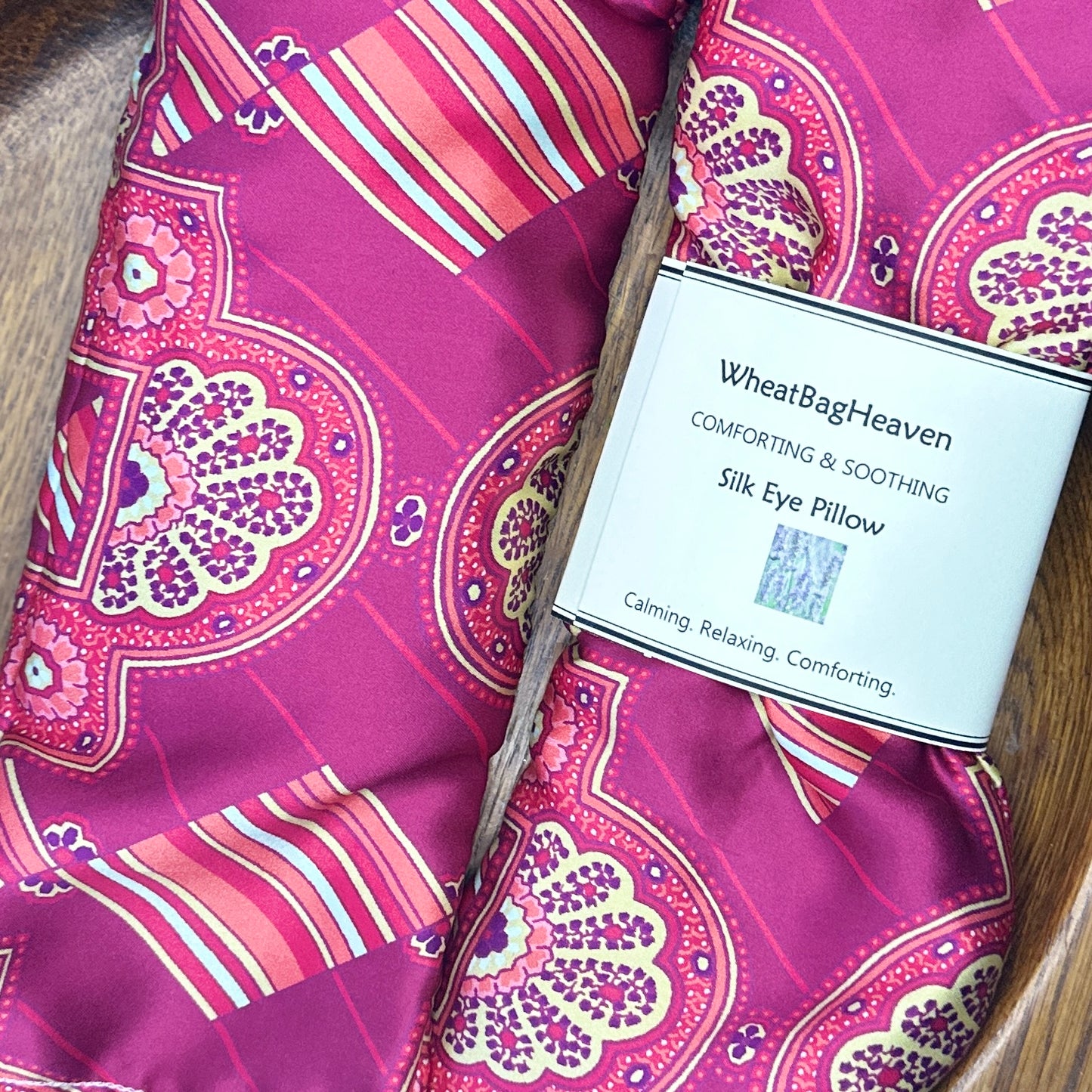 pair of pink silk sleep pillows filled with organic flaxseed and English lavender. Beautiful art deco print
