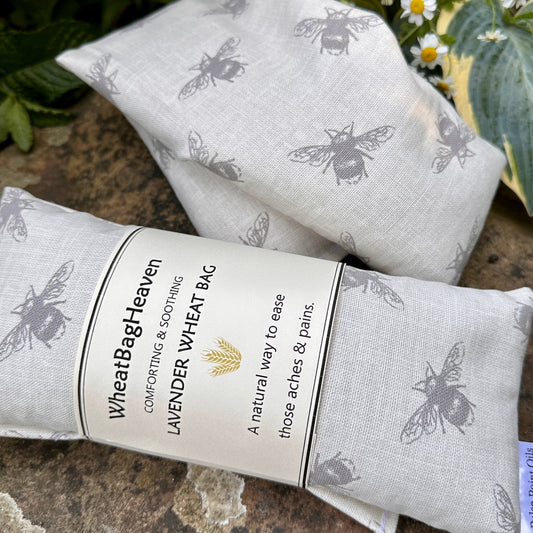 Bumble bee printed lavender scented wheat bag, grey bees on cream background in the garden at WheatBagHeaven 