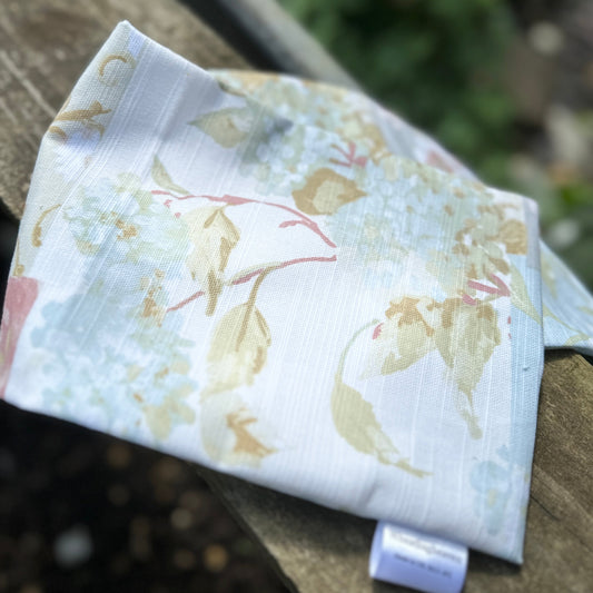 Replacement wheat bag cover in a pastel floral cotton patchwork print