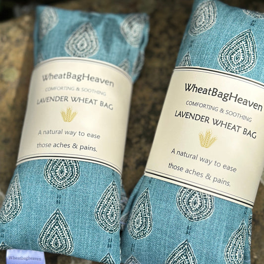 Blue teal cotton printed wheat bags with dried lavender flower, a natural eco friendly wheat bag to ease aches and pains or just to relax and comfort you. Handcrafted from Wheat Bag Heaven