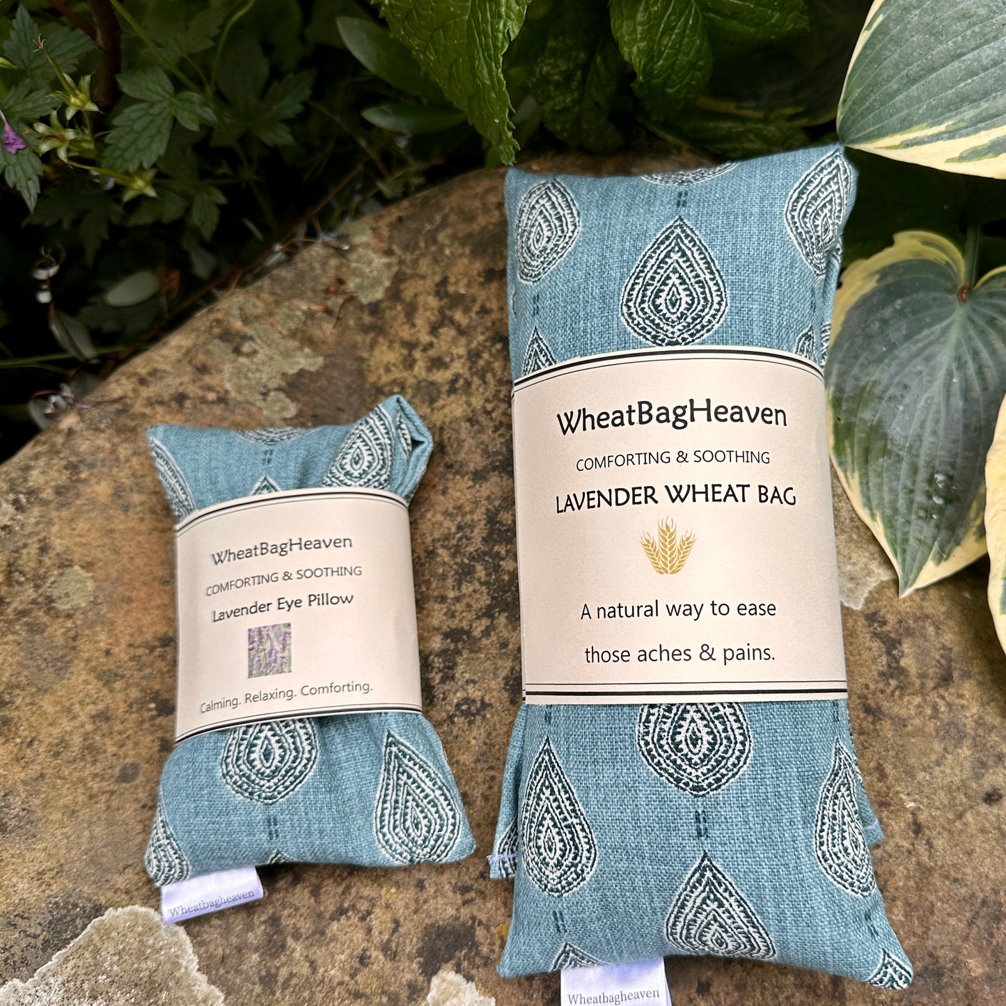teal blue flaxseed eye pillow alongside matching wheat bag both with English lavender fill for relaxation and comfort from WheatBagHeaven 