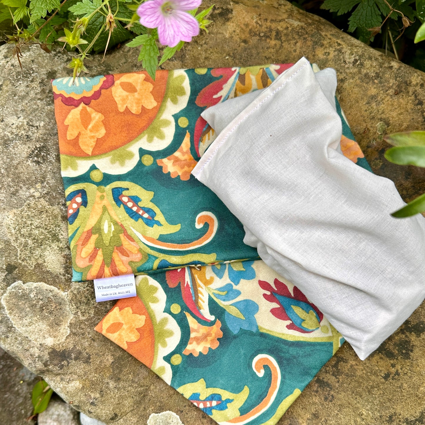 beautiful new cover for your wheat bag to revamp and mood change. floral print with envelope design for heating purposes. size 50x16cm