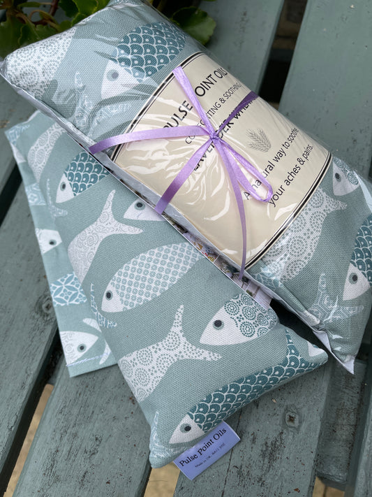Long lavender scented wheat bags, in a floral fish print.