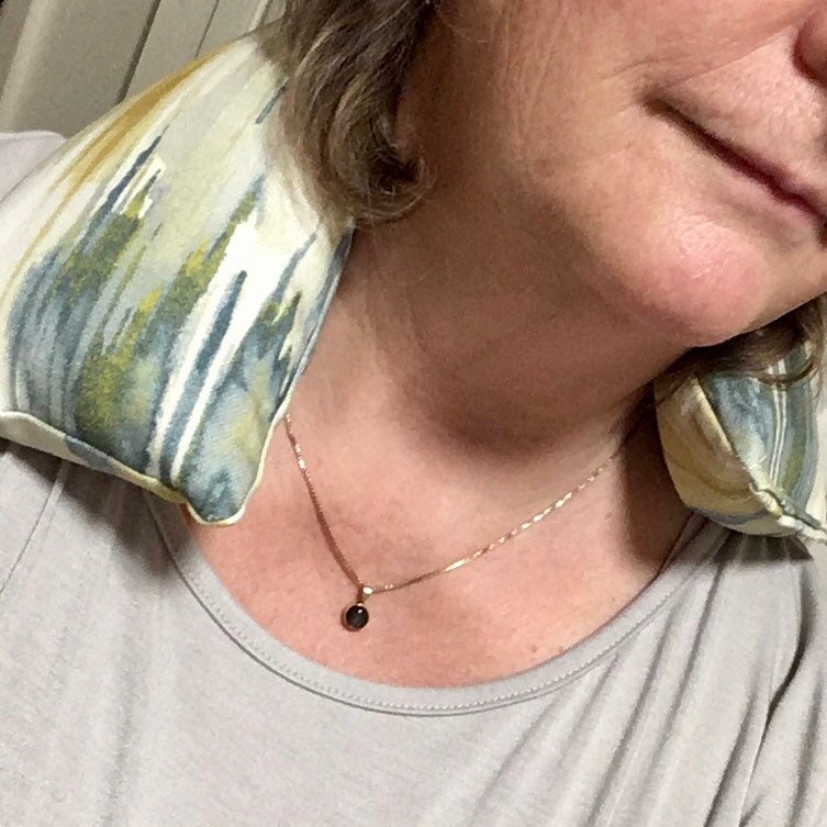 Woman using a Lavender heated neck wrap - LongBeach print Microwavable wheat bag - a beach colour palette of ochre, sea blues, greens and creams.
Practical hospital patient care package, whether it’s for yourself or a gift for someone else, these heat bags are comforting used warmed from the microwave or cooled from the freezer