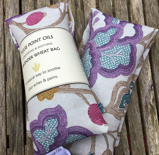 Lavender scented wheat bags. Heat pad body warmer. Natural pain reliever. Magnolia with purple, pink and blue print. 