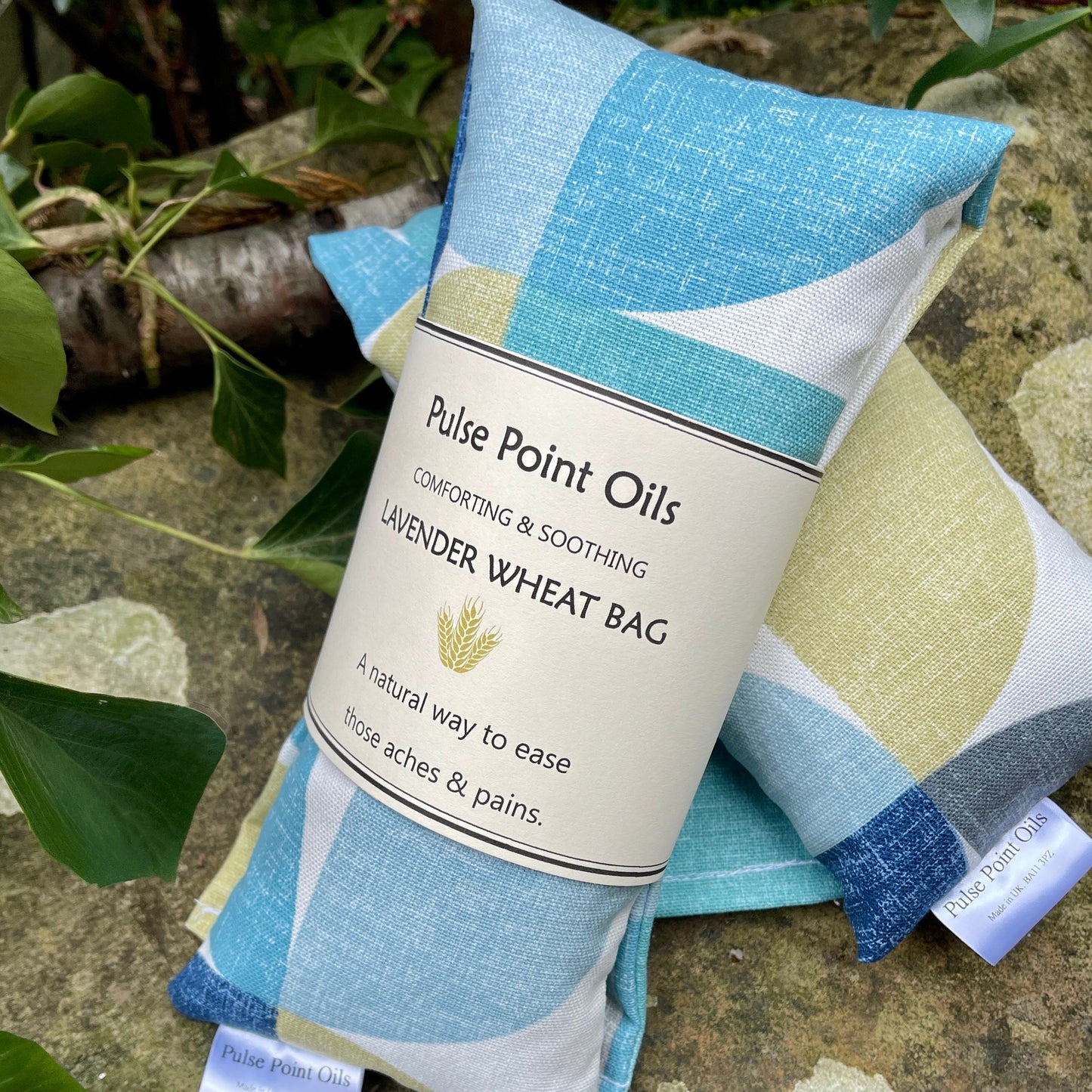 close up of abstract fabric (Cynthia) blues and greens wheat bag