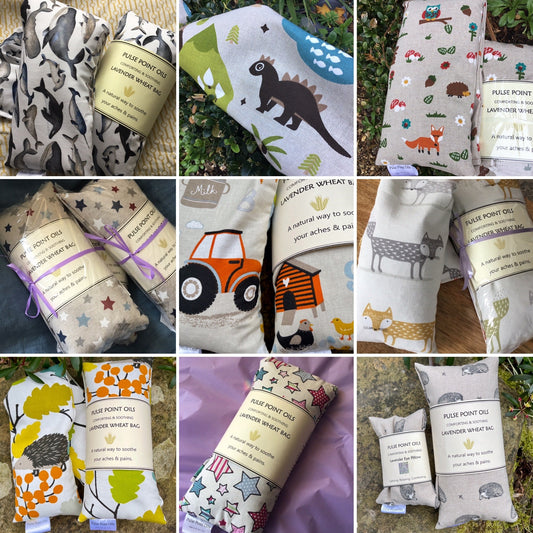 a range of childrens wheat bags in various fabric designs depicting stars, farm  animals, woodland animals, sea life 47x12cm cotton fabric