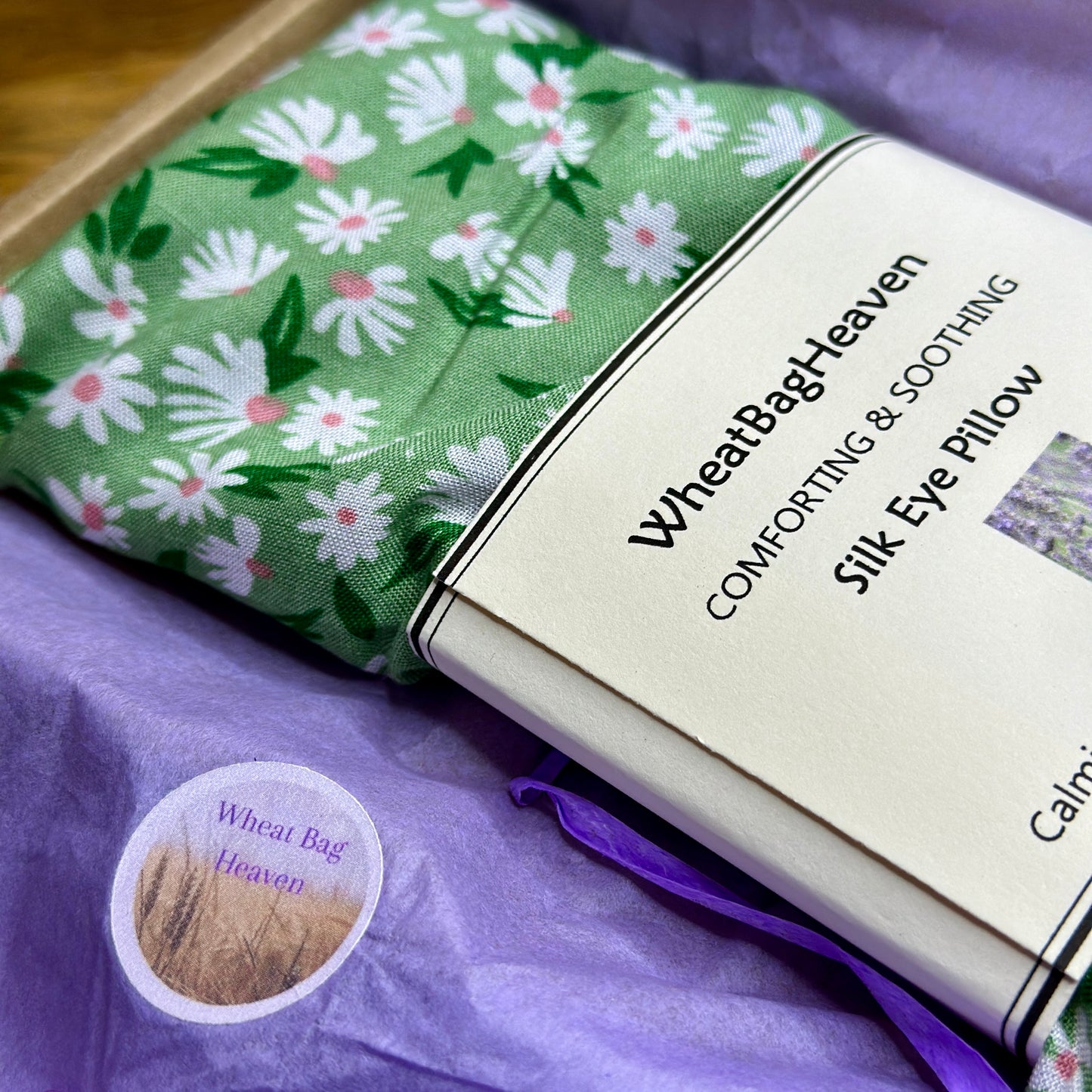 Large sized flax seed eye pillow in a lovely daisy print on a green background with the added benefits lavender, Yogi letterbox care gift