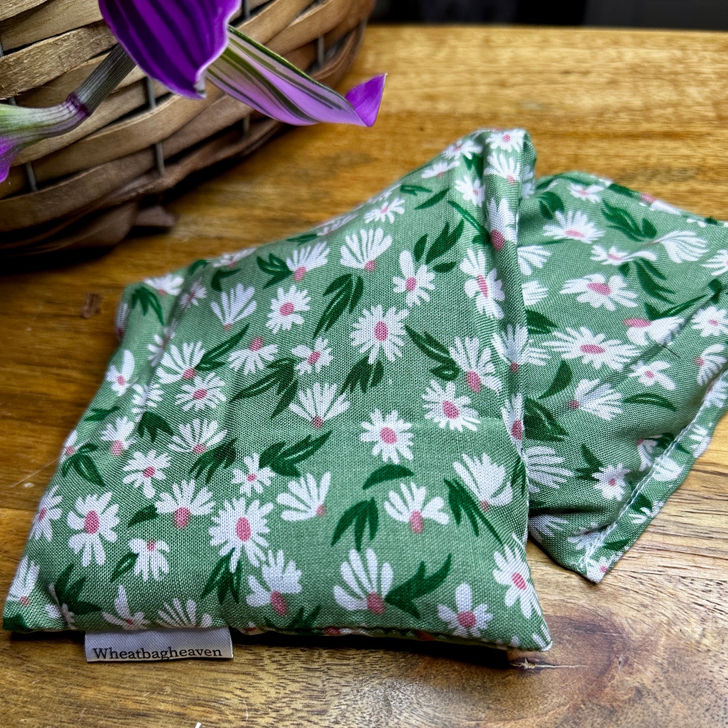 Large sized flax seed eye pillow in a lovely daisy print on a green background with the added benefits lavender, Yogi letterbox care gift