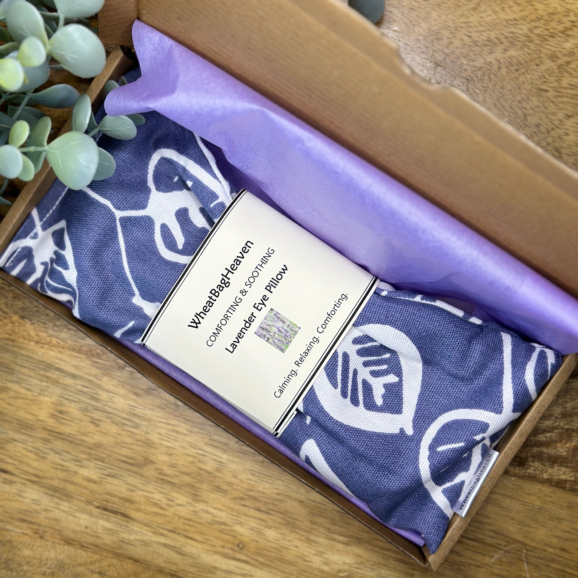 denim blue flax seed and lavender eye pillow in a letterbox sized postal box