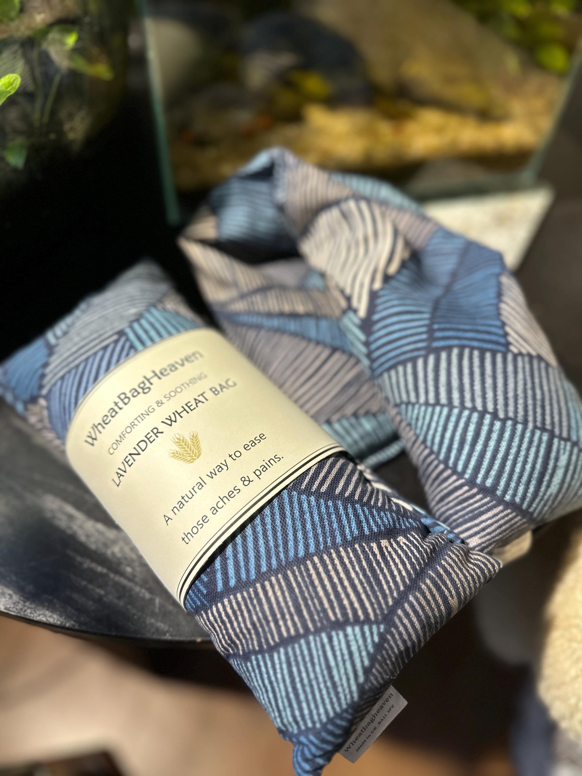 handmade wheat bag provides soothing warmth and comfort without fuss or hassle. Featuring a masculine navy and black Aztec Abstract print design on quality cotton fabric, this microwavable heat pack is the perfect practical gift for the man who deserves a moment of relaxation and self-care.

Filled with British wheat and English lavender,