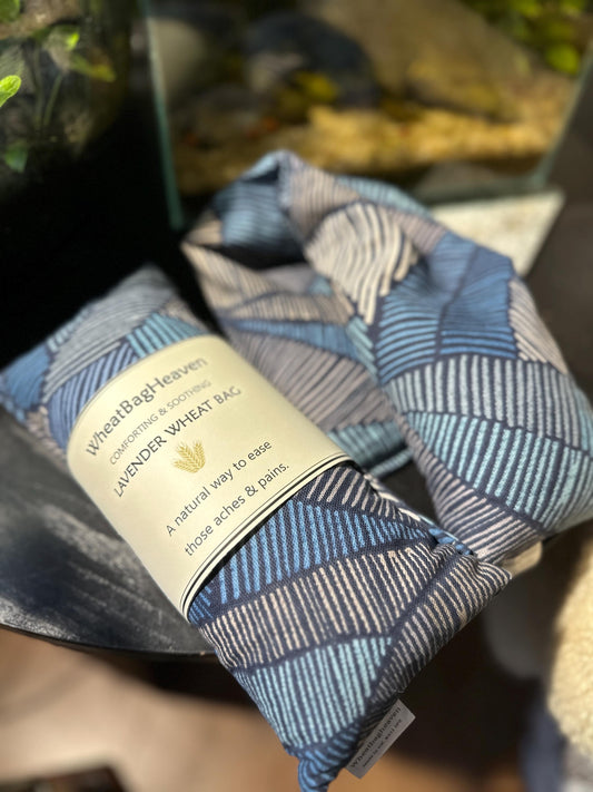 handmade wheat bag provides soothing warmth and comfort without fuss or hassle. Featuring a masculine navy and black Aztec Abstract print design on quality cotton fabric, this microwavable heat pack is the perfect practical gift for the man who deserves a moment of relaxation and self-care.

Filled with British wheat and English lavender,