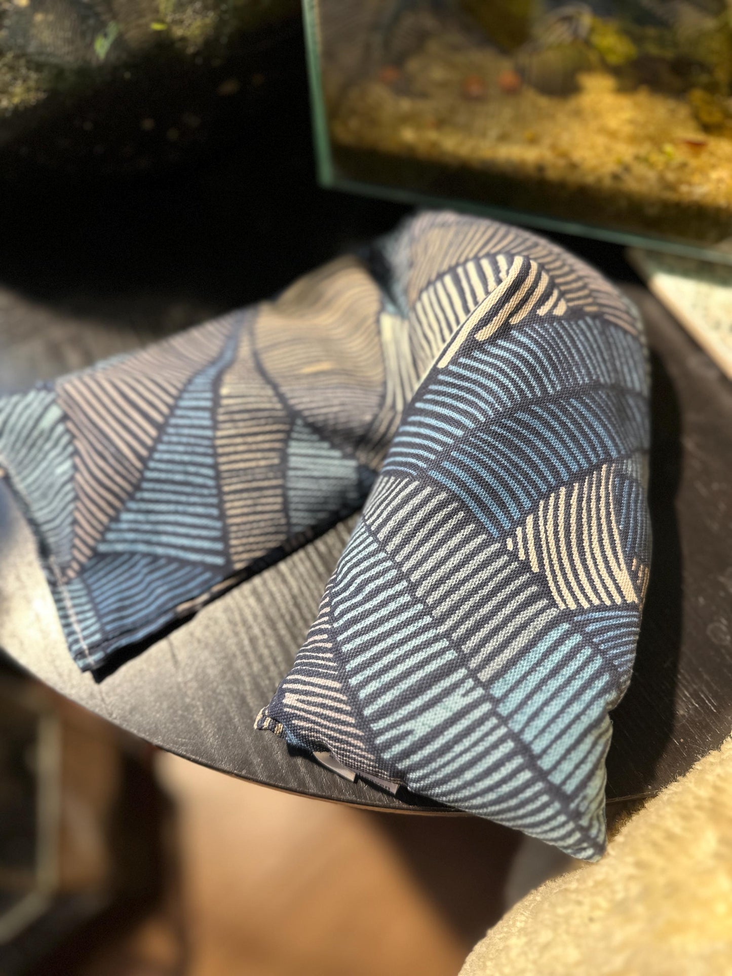 handmade wheat bag featuring a masculine navy and black Aztec Abstract print design on quality cotton fabric, this microwavable heat pack is the perfect practical gift for the man who deserves a moment of relaxation and self-care.

Hand filled with British wheat and English lavender,
