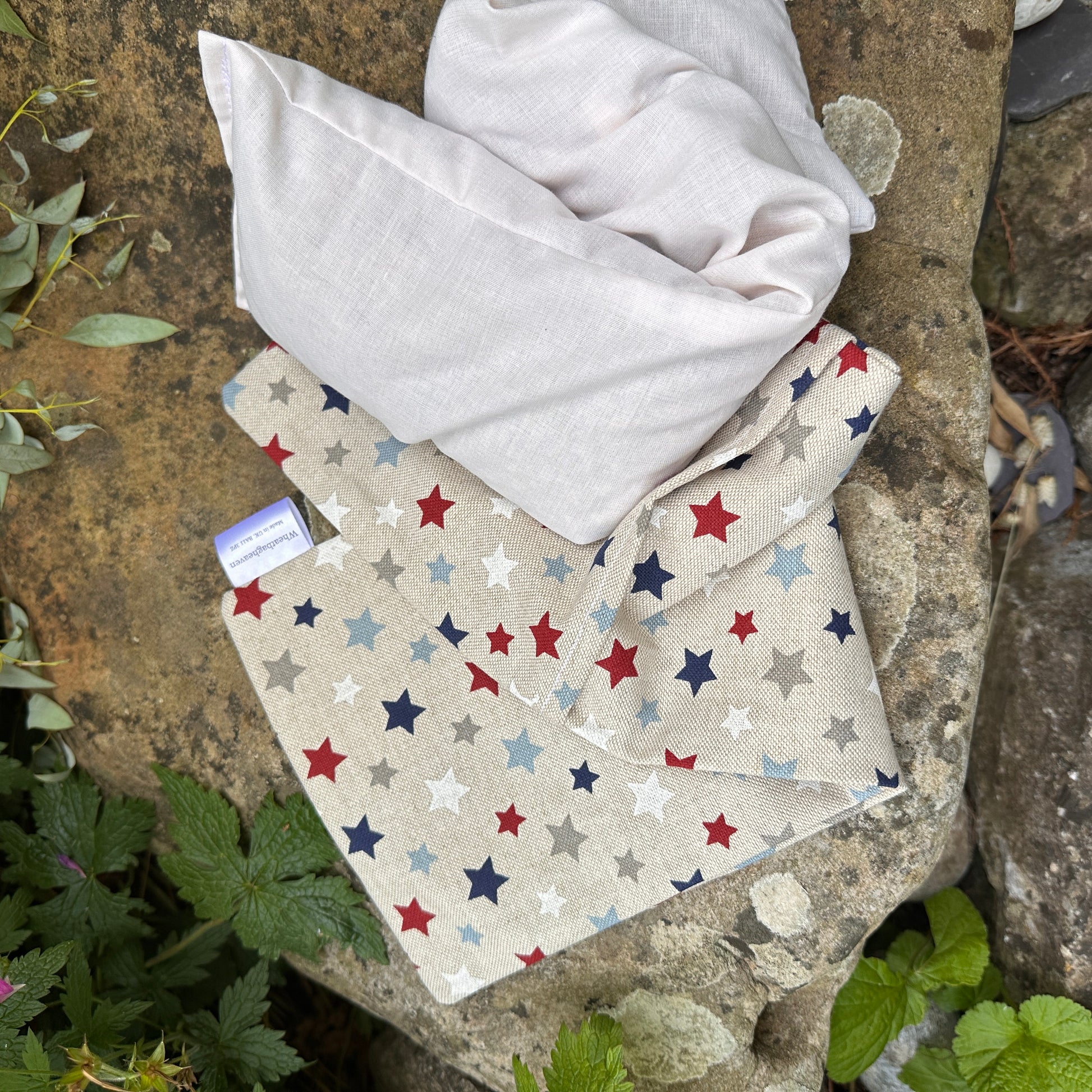 Inside and outside parts of long Wheat bags. Star cotton fabric heat pack with lavender flower.