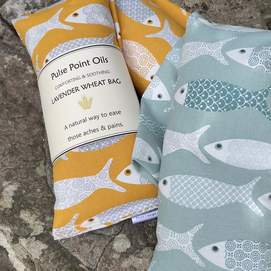 Long lavender scented wheat bags, in a floral fish print. 
