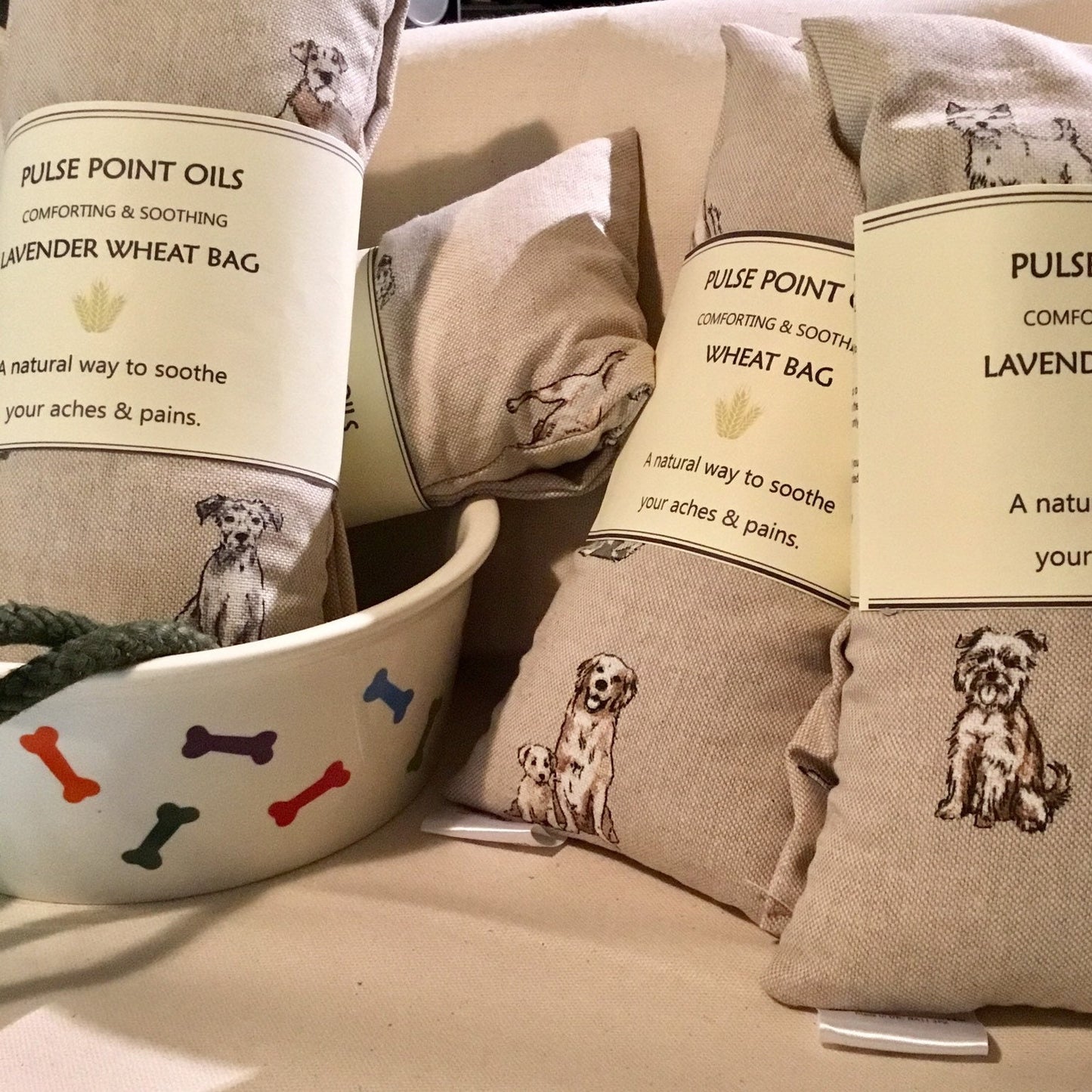 Group of dog print lavender herbal wheat bag, aromatherapy heat wrap body warmer. Warming neck wrap