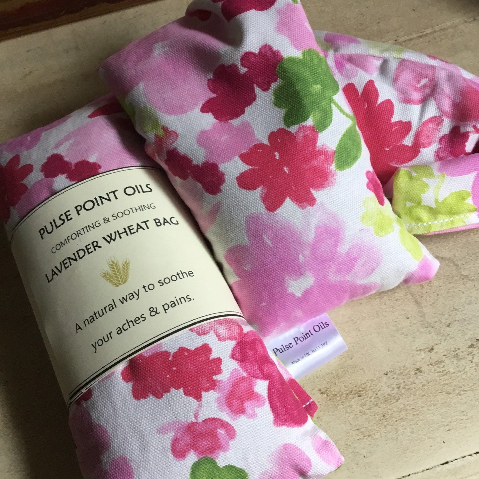 pink peony wheat bag neck wrap filled with lavender buds and whole wheat