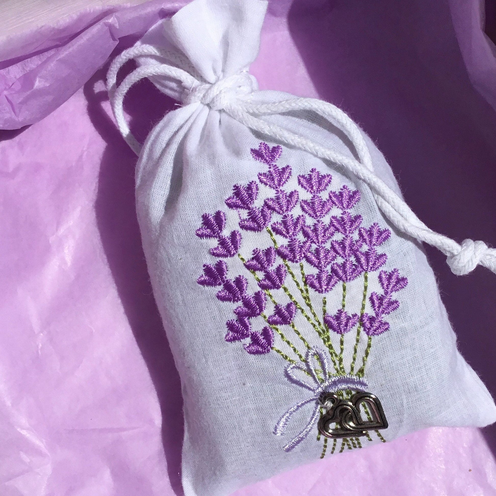 Embroidered Lavender bag plus wellbeing balm. Lavender embroidered bag with small metal hearts.