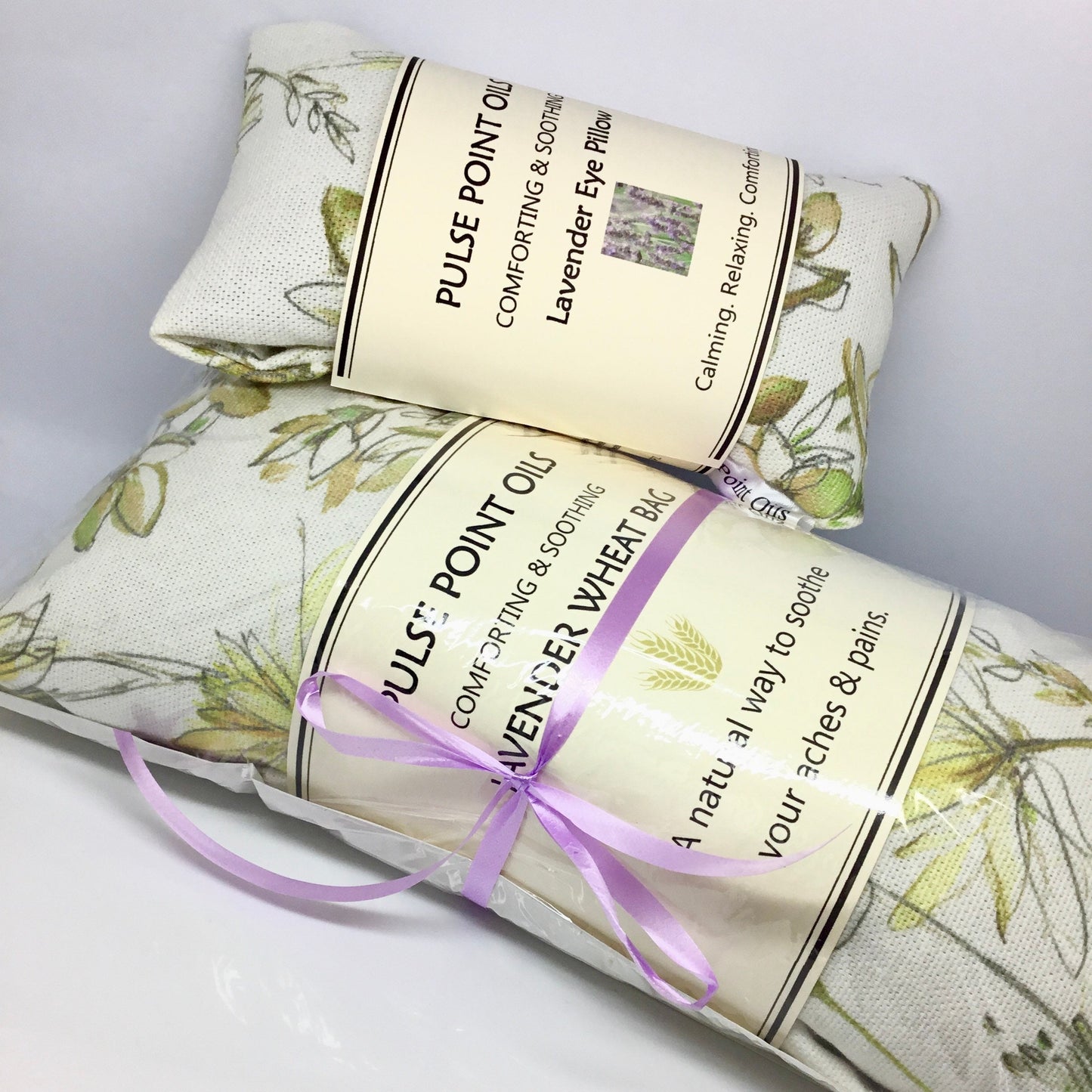 Floral meadow heating pad, lavender wheat bags, with purple ribbon. 