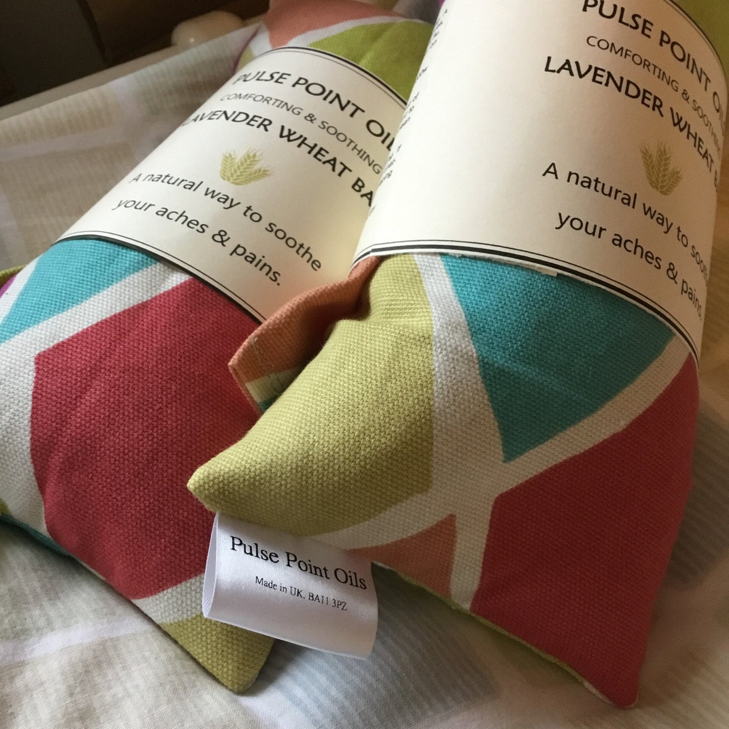 two red, blue and green lavender scented long wheat bag, practical re-usable heat pad