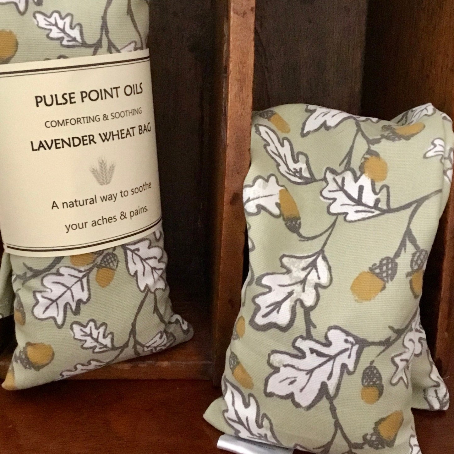 Long wheat bag in acorn wood print lavender scented heating pad.