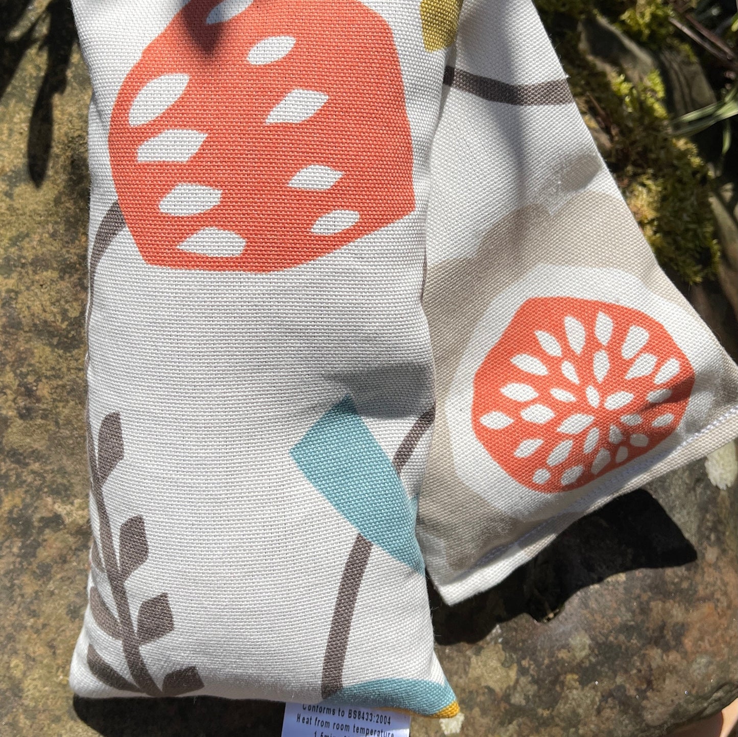 pretty microwave long scented wheat bag in a simple scandi cotton print, perfect aromatherapy neck wrap from wheatbagheaven