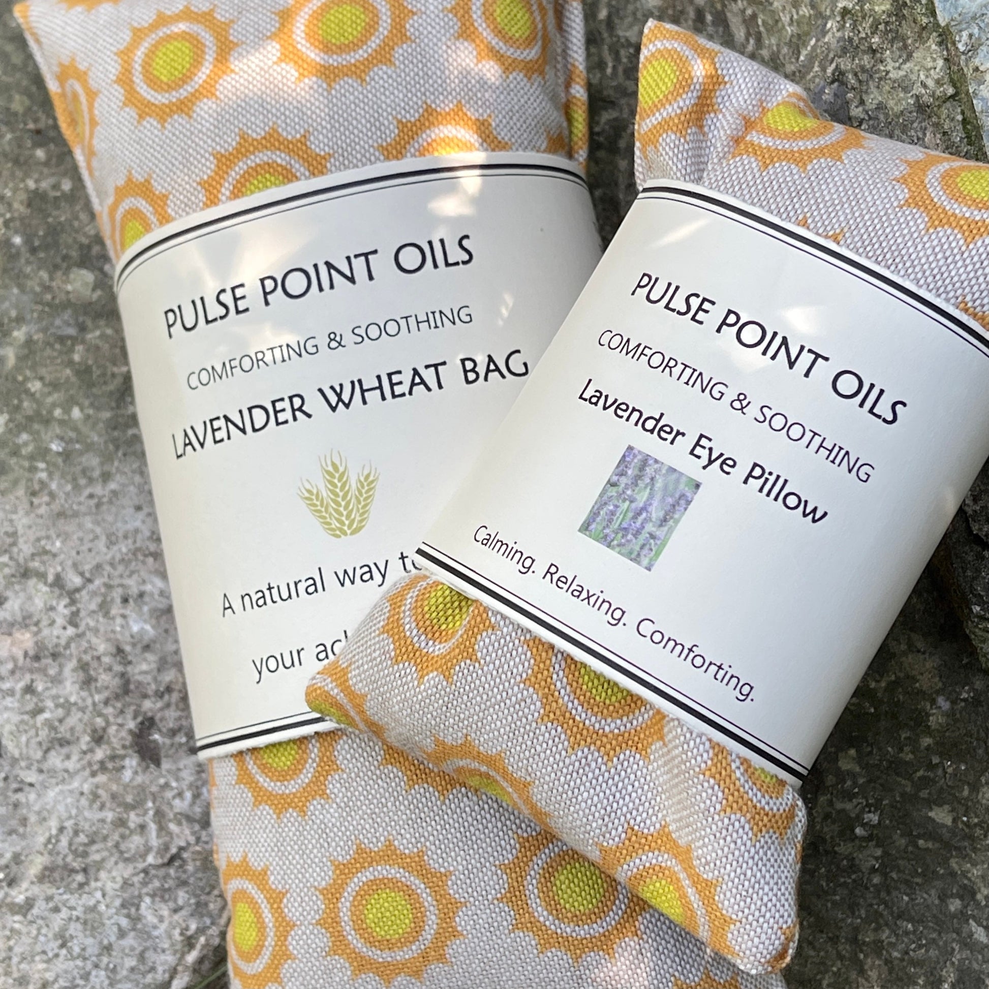 Long cotton fabric wheat bag with lavender buds size 47x12cm and a lovely eye pillow size 20x10cm in the same fabric for relaxation and comfort. Sunshine print on a beige background holistic wellbeing gifts