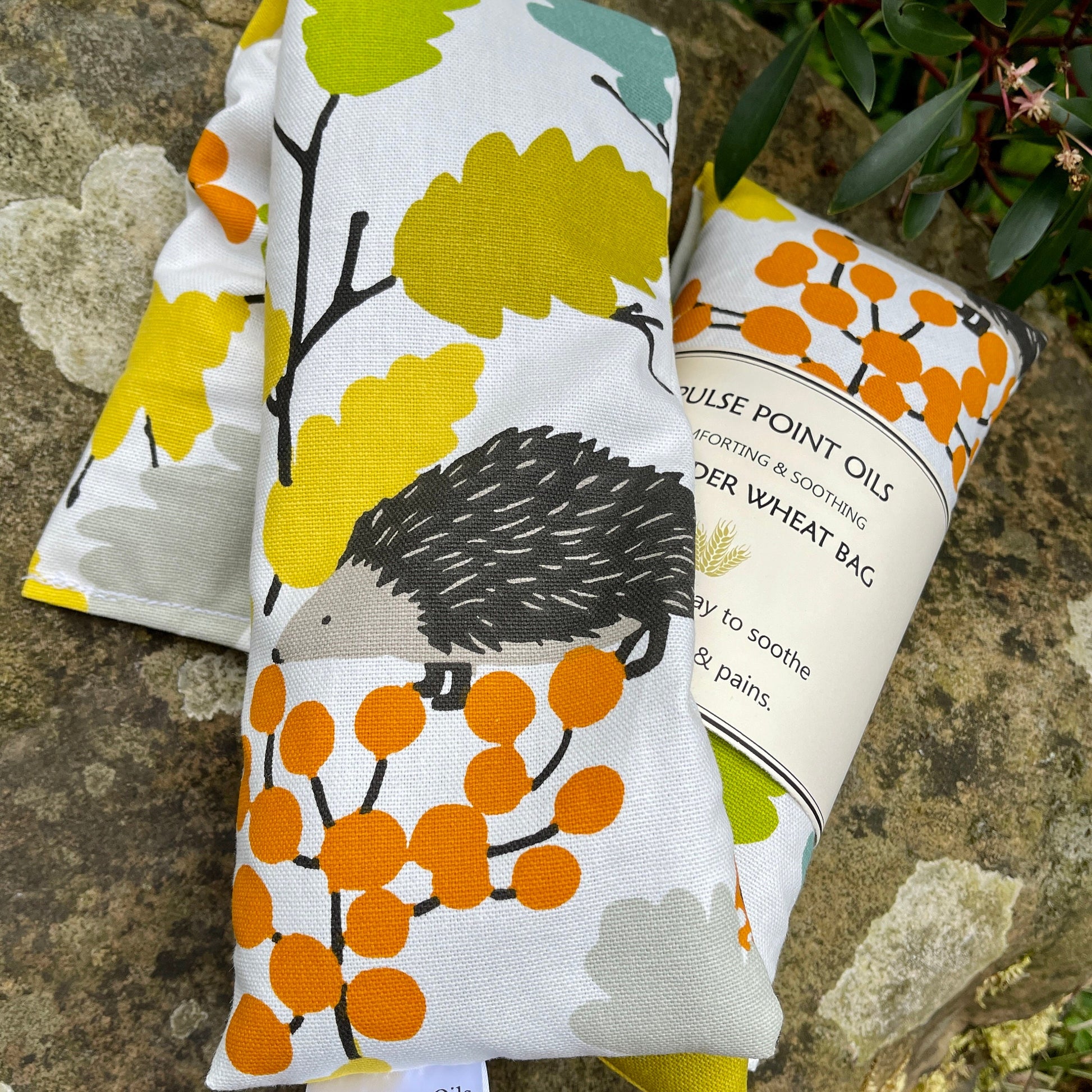 Bright cheery wheat bag in a hedgehog cotton print for aches and pains, comfort and relaxation.