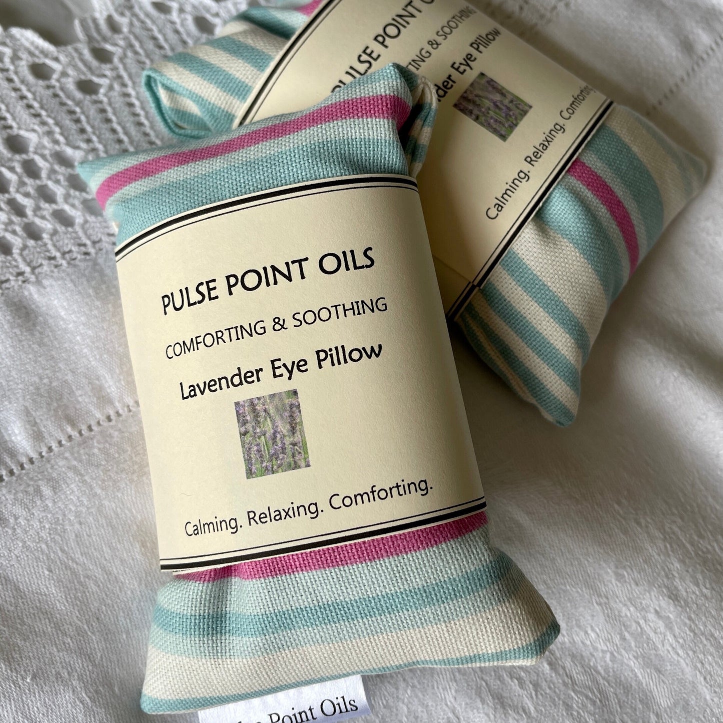 Eye pillows in a blue and pink cotton candy stripe, filled with lavender. 