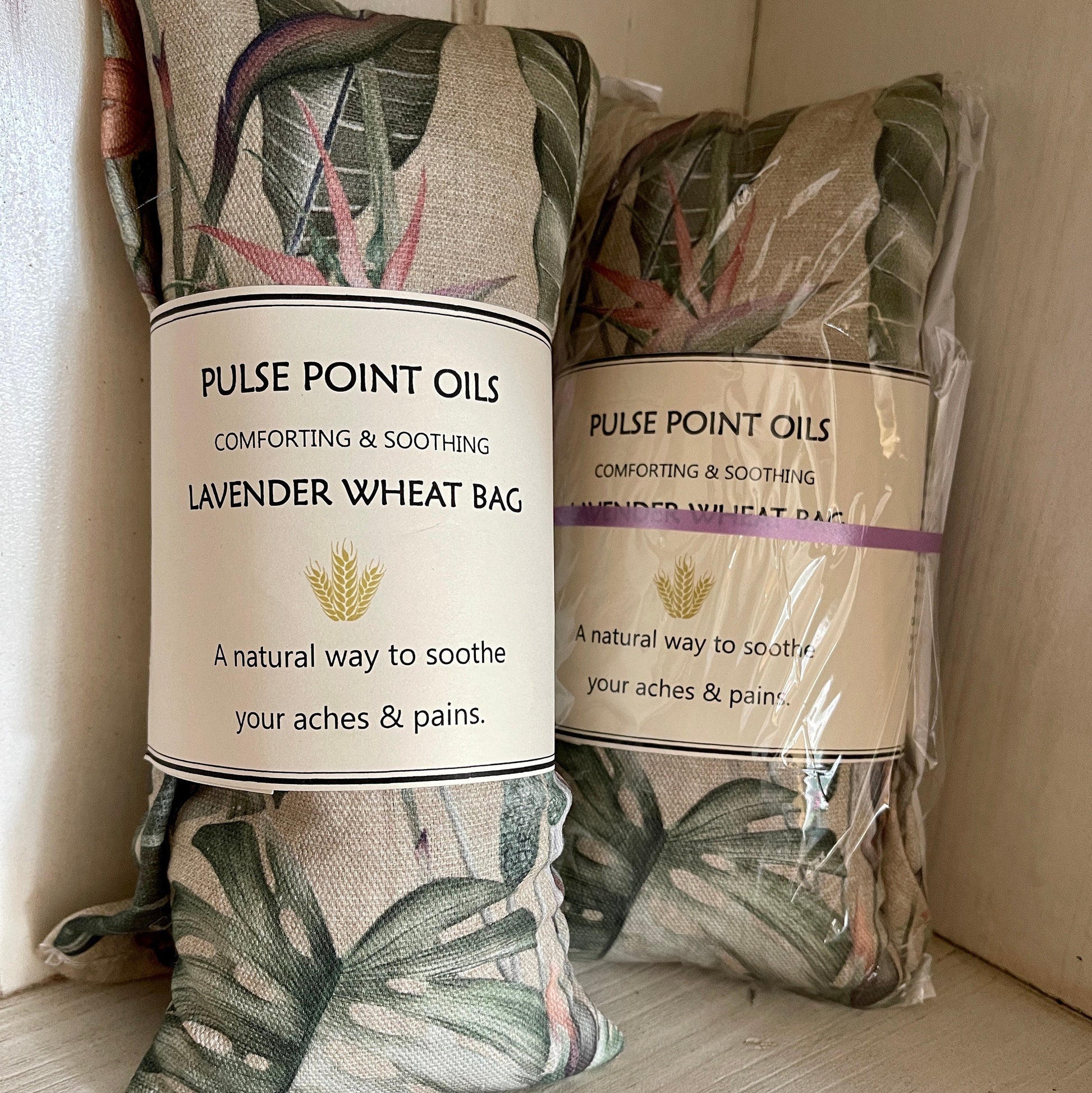 Two lavender wheat bags, wellness and wellbeing gifts in tropical paradise print