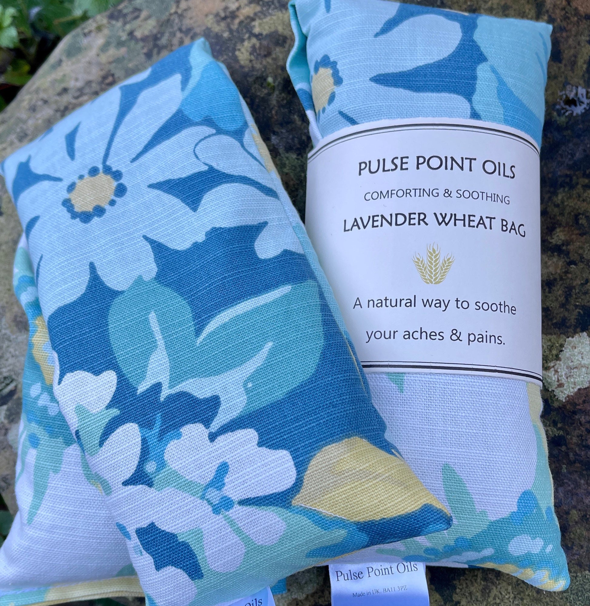 Blue floral wheat bag heat pack use as a warming neck wrap to release stress and tension 
