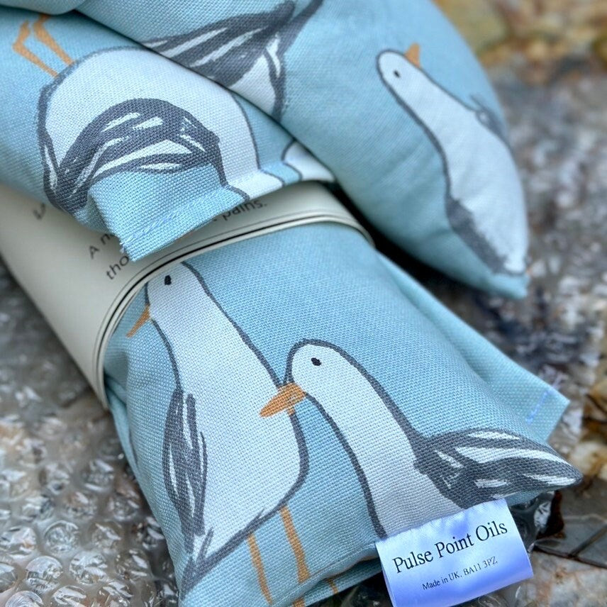 Close up of lavender scented long wheat bag, seagull print heatable neck wrap.