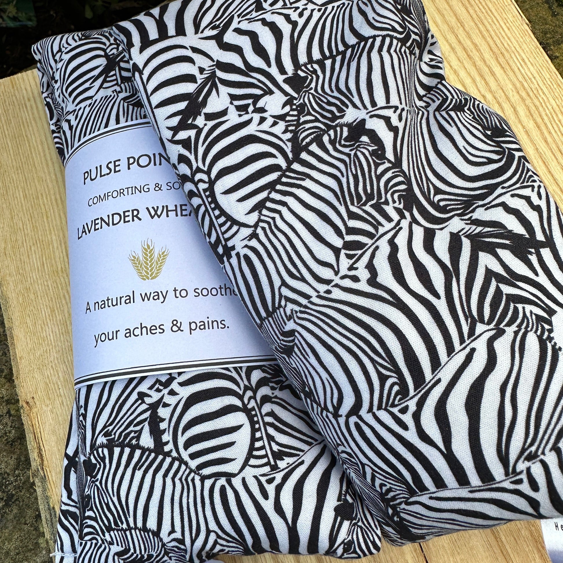 monochrome zebra printed long cotton wheat bags. Re-heatable and reusable heat source for natural pain relief