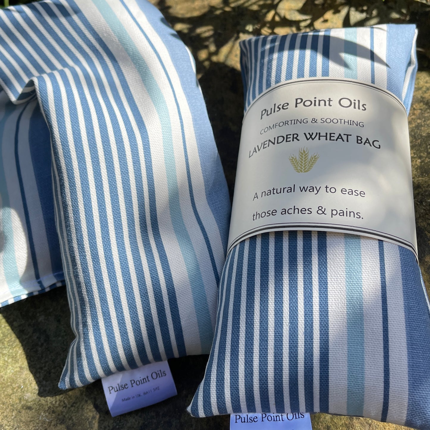 Scented wheat bag, lavender denim blue stripe hottie heating pad, body warmer for wellness and relaxation.