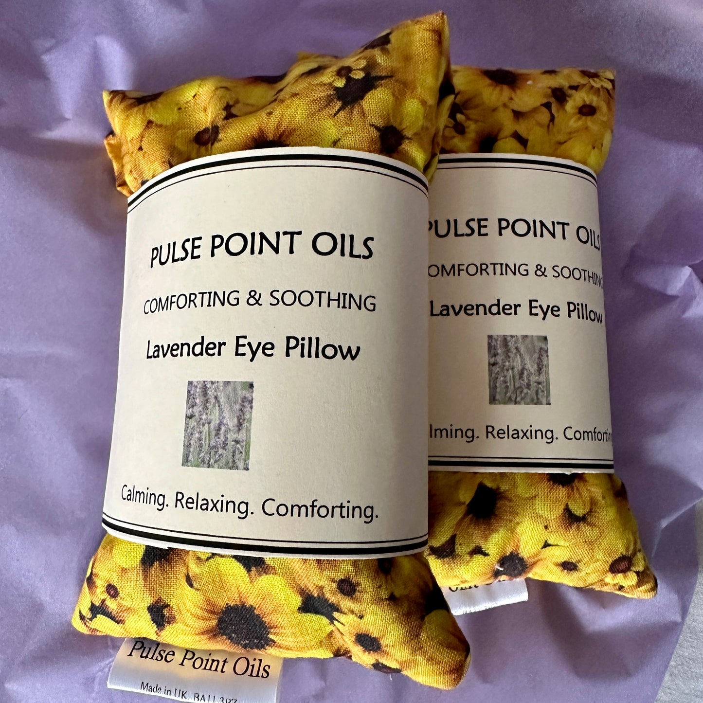 Pair of lavender eye pillows with flax seed in a lovely sunflower cotton print. Handcrafted by WheatBagHeaven