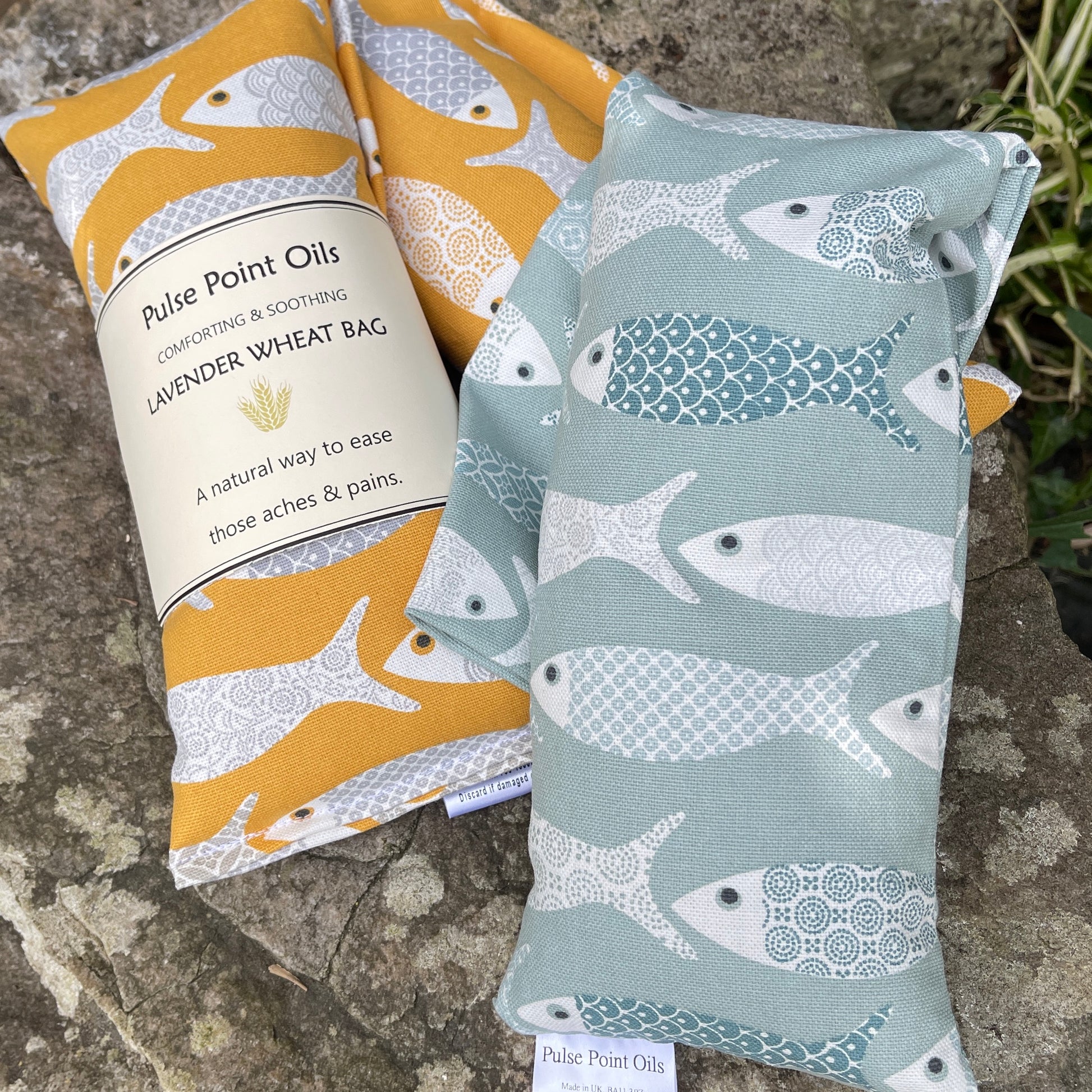 Long lavender scented wheat bags, in floral fish print. Holistic heat pad for aches and pains. 